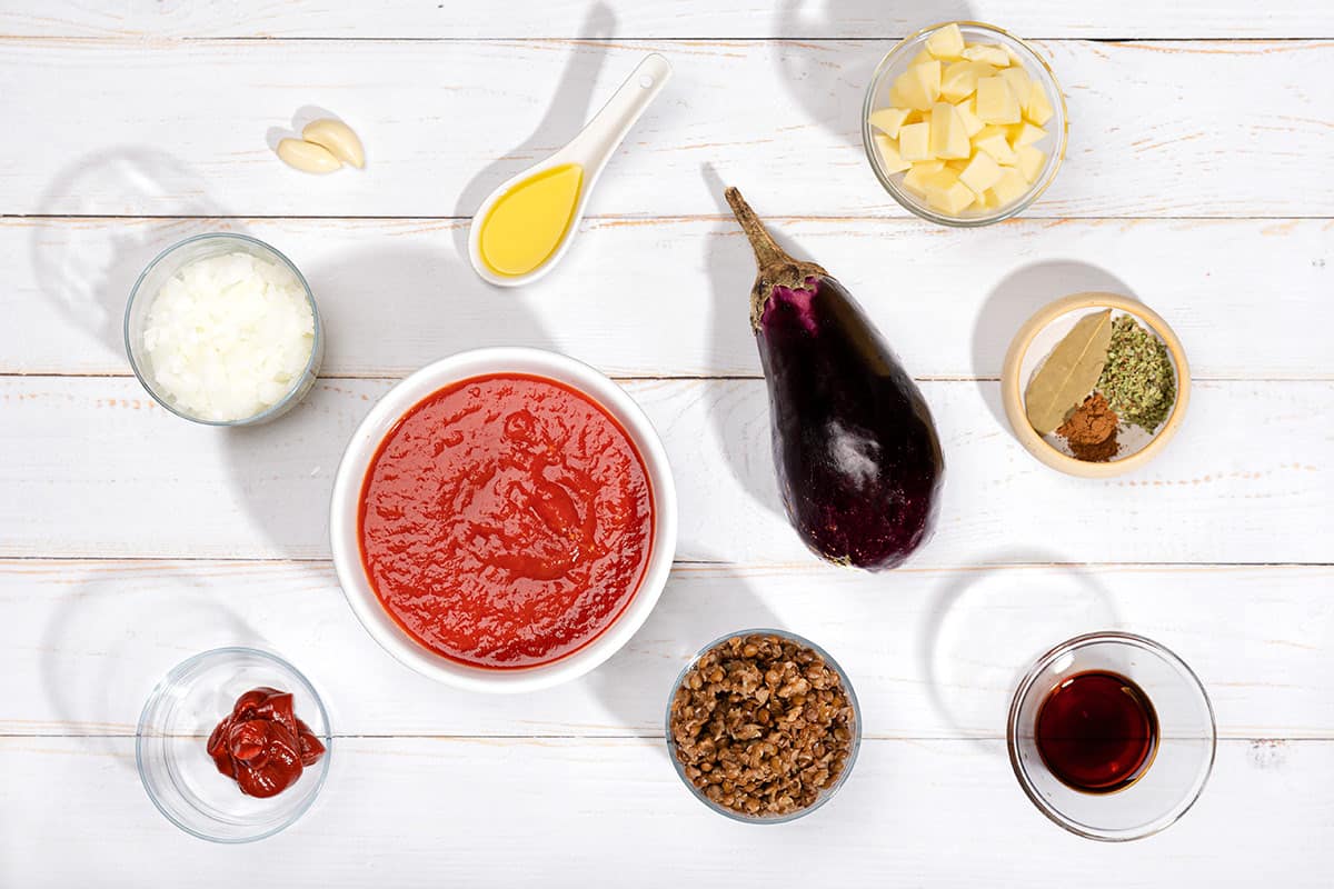 Vegetarian Moussaka ingredients like eggplant, onion, garlic, tomato, lentils, soy sauce, mozzarella etc. | Hurry The Food Up